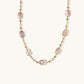 Iridescent baroque pearls alternating with small freshwater pearls on 14K gold-plated chain
